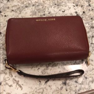 Continental wristlet.  True color is Cinnamon.